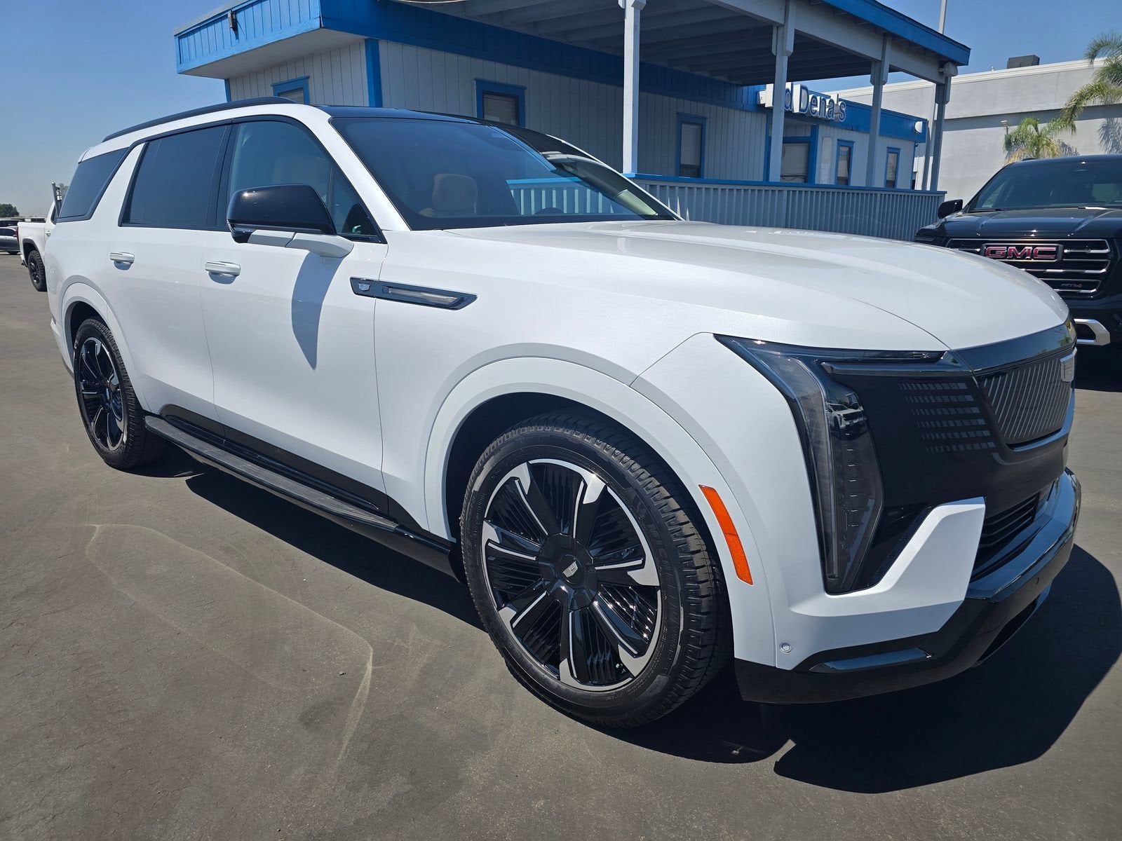2026 Cadillac ESCALADE IQL Premium Sport in Vibrant White Tricoat — front three-quarter view